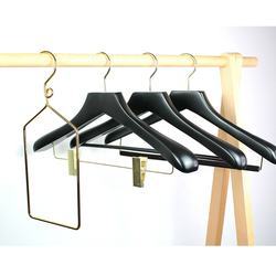 Black hotel wooden hangers with gold hook and clips