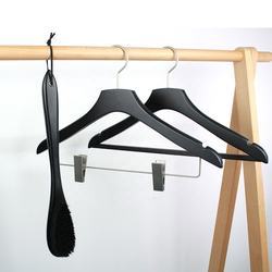 Black hotel wooden hangers with gold hook and clips