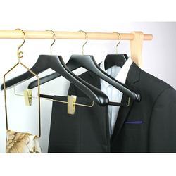 Black hotel wooden hangers with gold hook and clips
