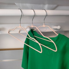 Children size heavy duty pink infant metal coat hangers