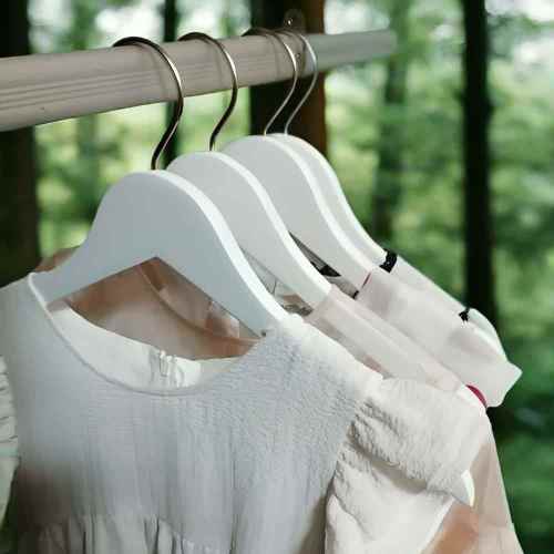 White wooden infant baby hangers