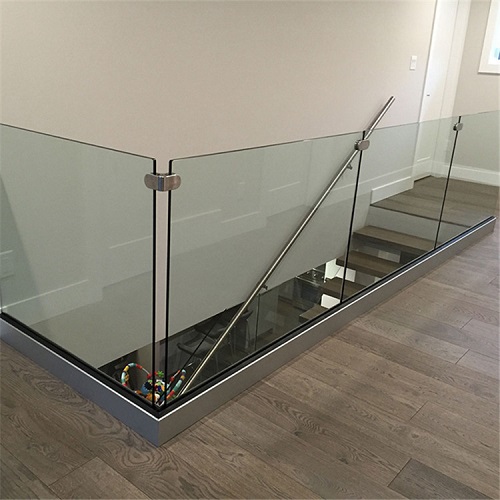Frameless modern glass railing with u channel base fixings
