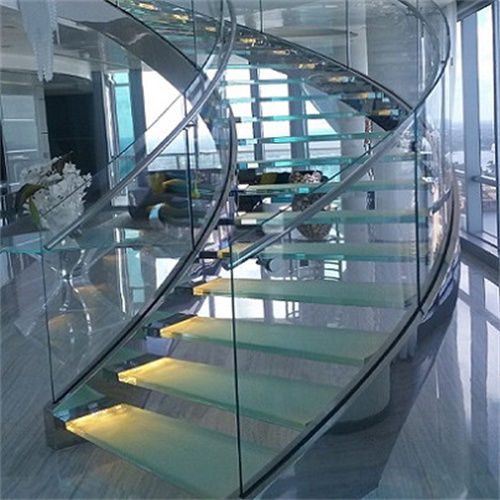 Fancy curved staircase design with glass steps