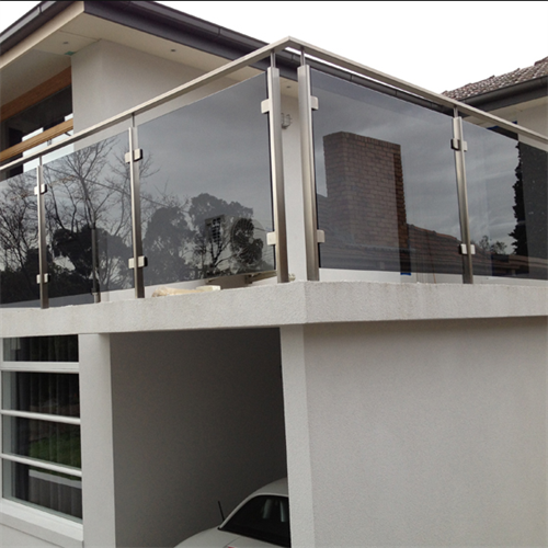 Grey tinted glass railing for outdoor balcony railing designs glass balustrade