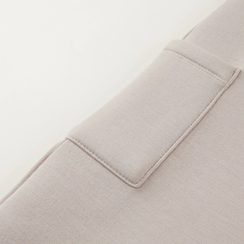 Close-up pocket of  breathable, soft baby scuba dungarees