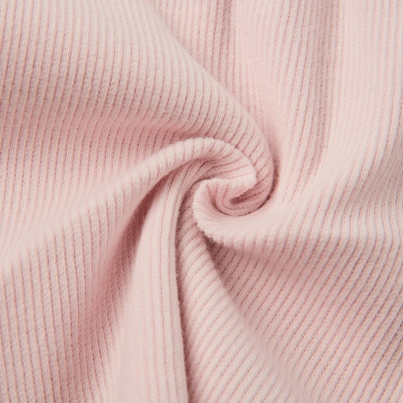 Close-up of rib knit texture and elastic waistband on baby shorts