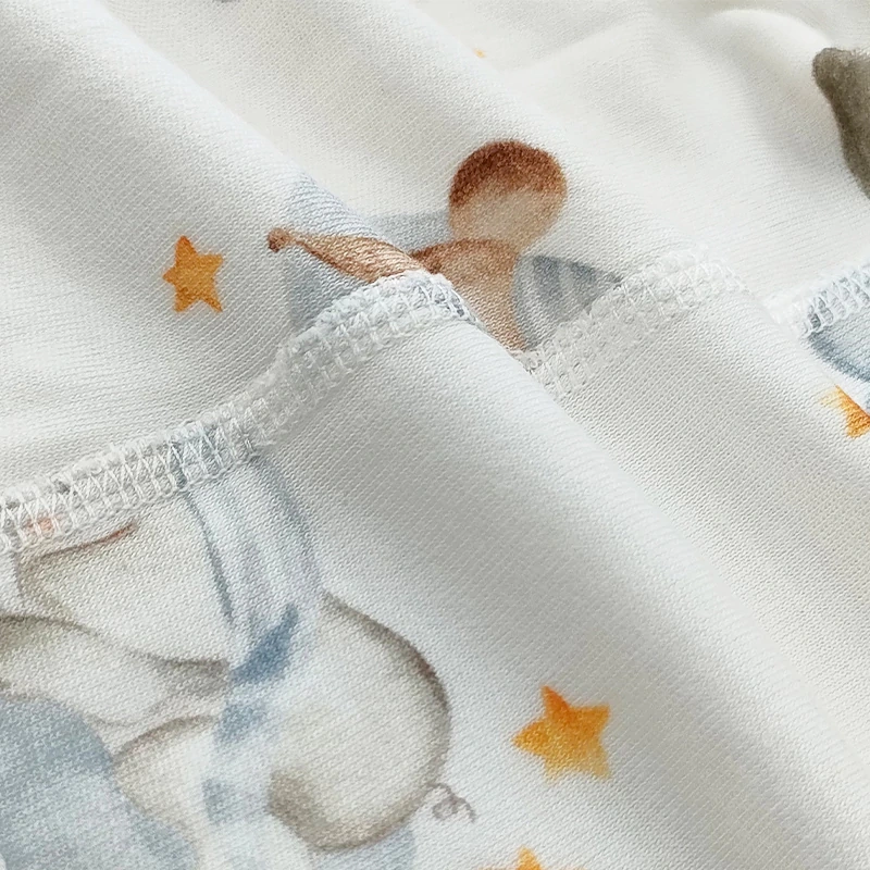 Close-up inner seam of bamboo cotton fabric on baby romper