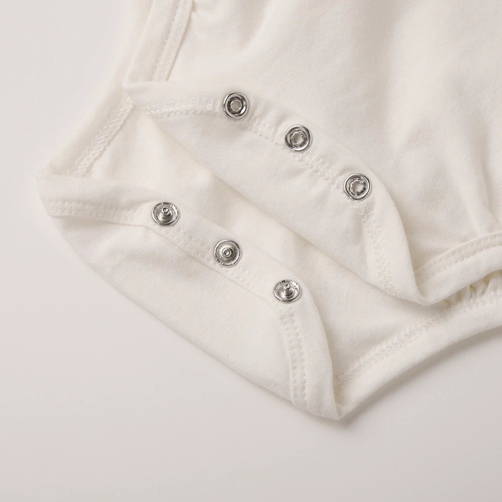 Flat-lay of festive dog baby bodysuit, soft jersey knit