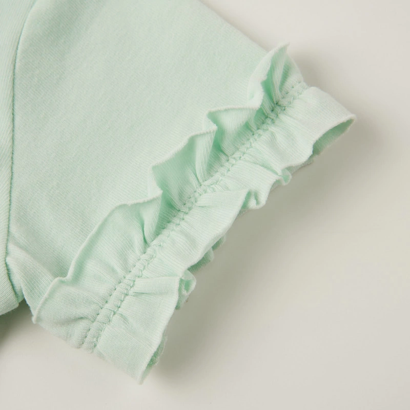 Ruffle sleeve close-up — naturally dyed color