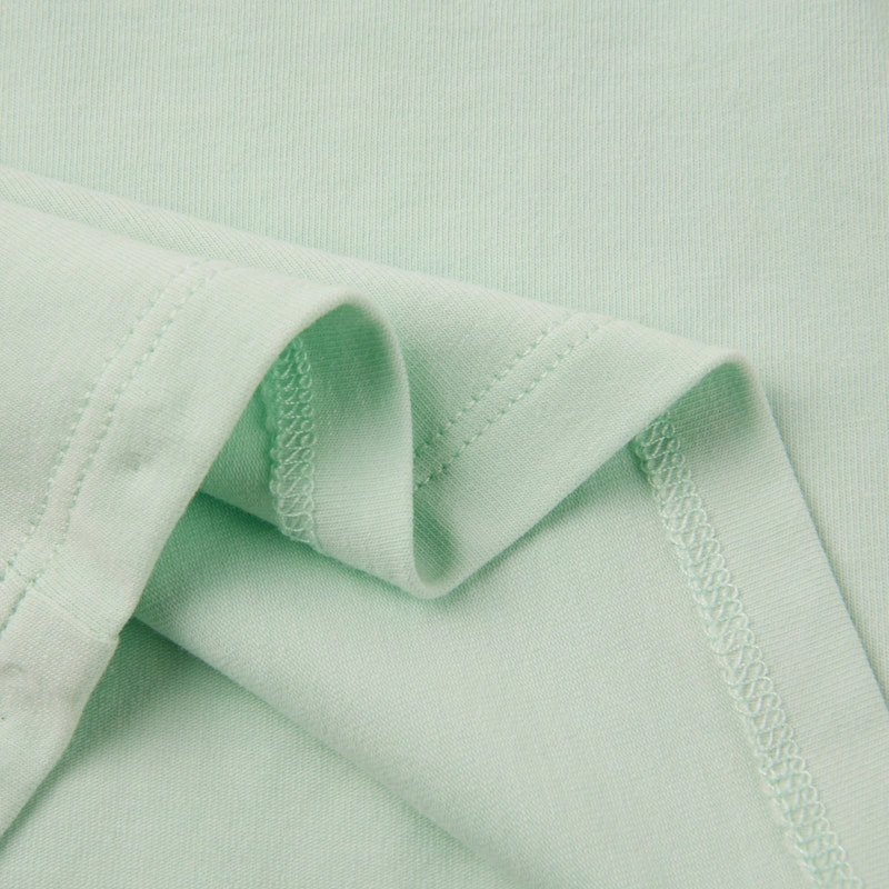 GOTS-certified organic baby girl ruffle short sleeve tee in natural plant dye