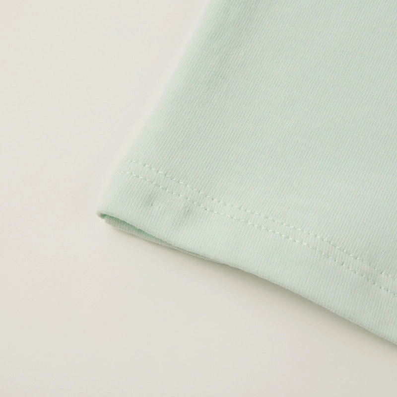 Back/hem detail — plant-dyed baby tee