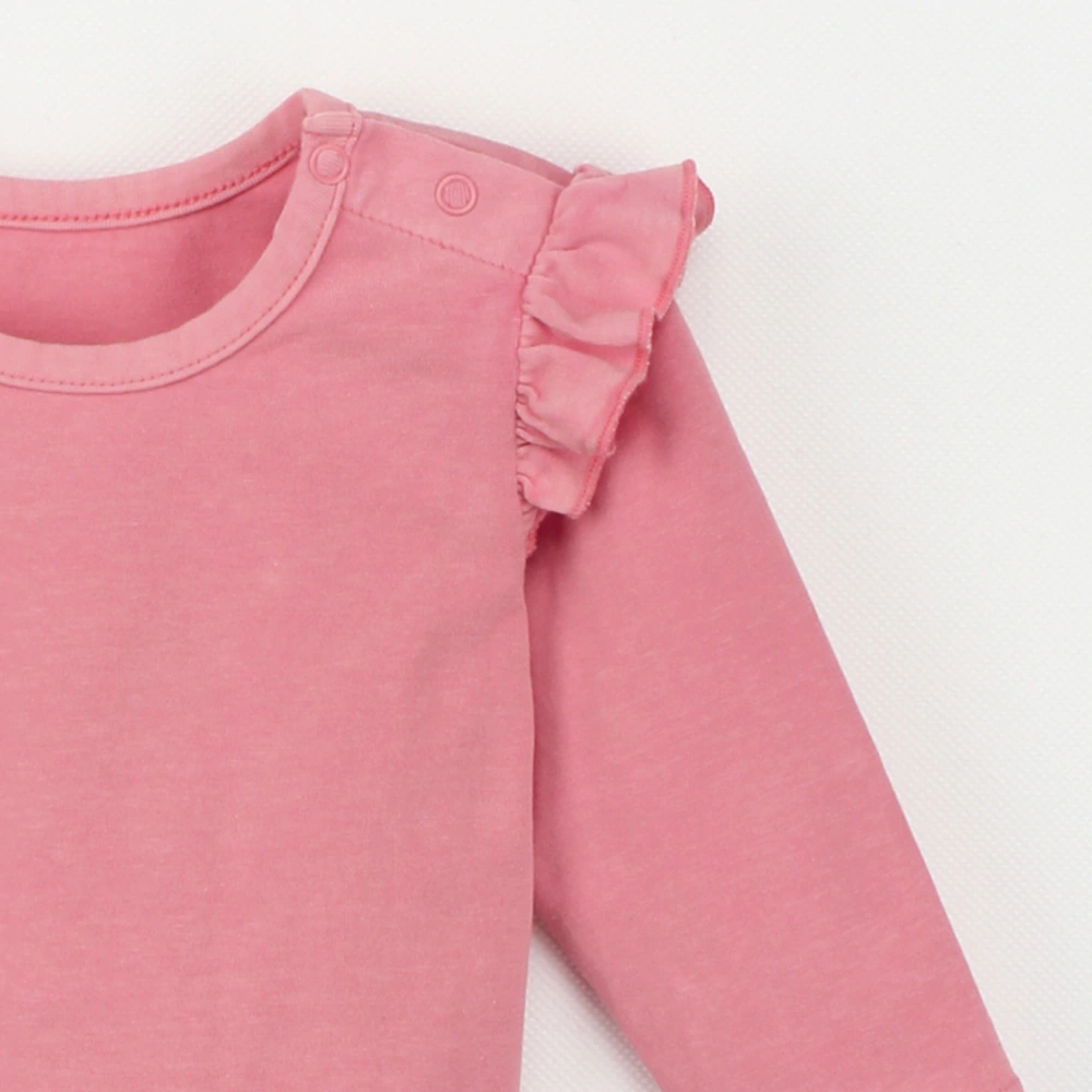 Close-up details of Plant-dyed organic-cotton flutter long sleeve baby tee