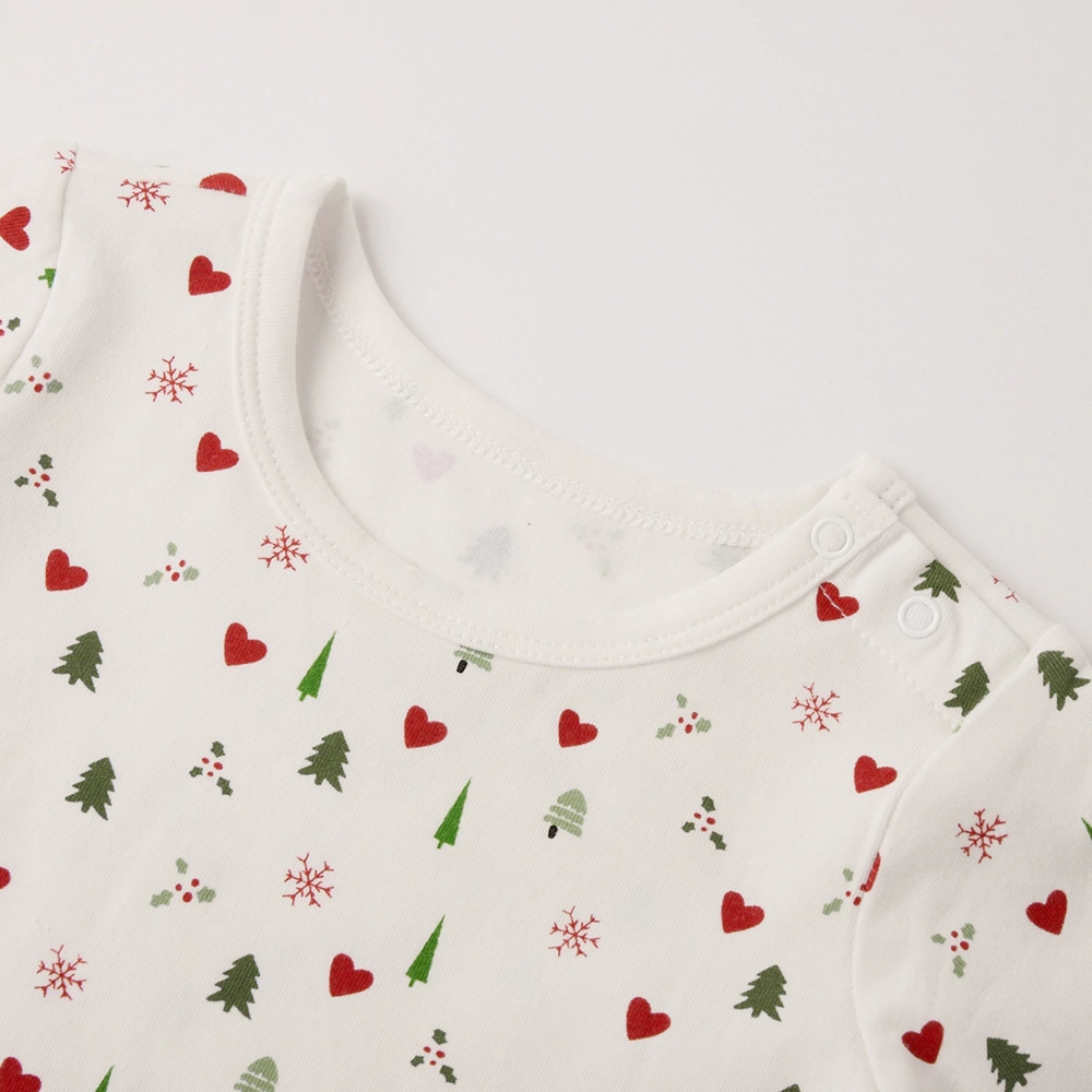 Close-up of lap-shoulder and snap bottom on Happy Xmas baby romper