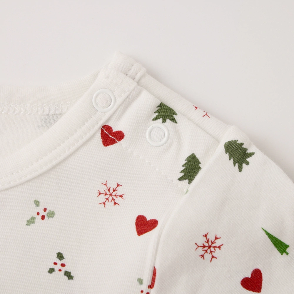 Close-up of lap-shoulder and snap bottom on Happy Xmas baby romper