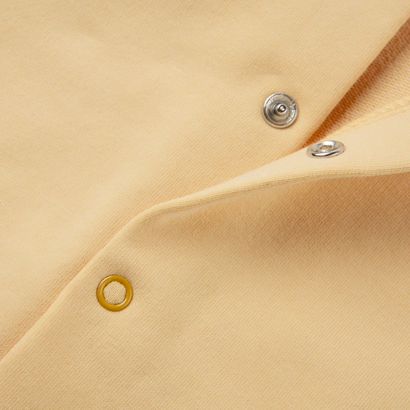 Senseng organic cotton sleeveless baby romper in plant-dyed yellow