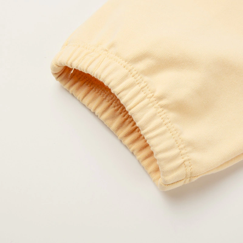 Senseng organic cotton sleeveless baby romper in plant-dyed yellow