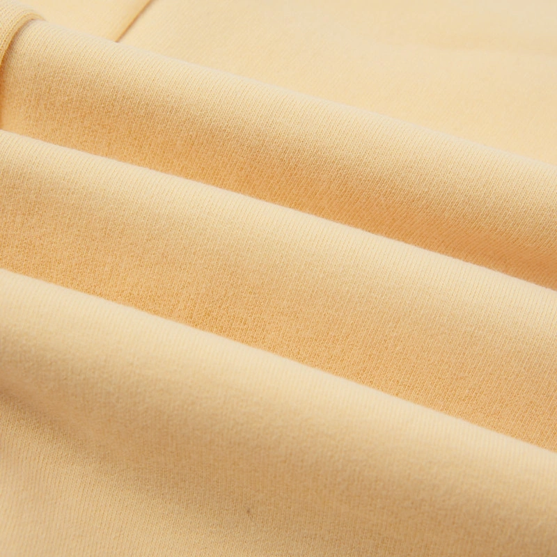 Senseng organic cotton sleeveless baby romper in plant-dyed yellow