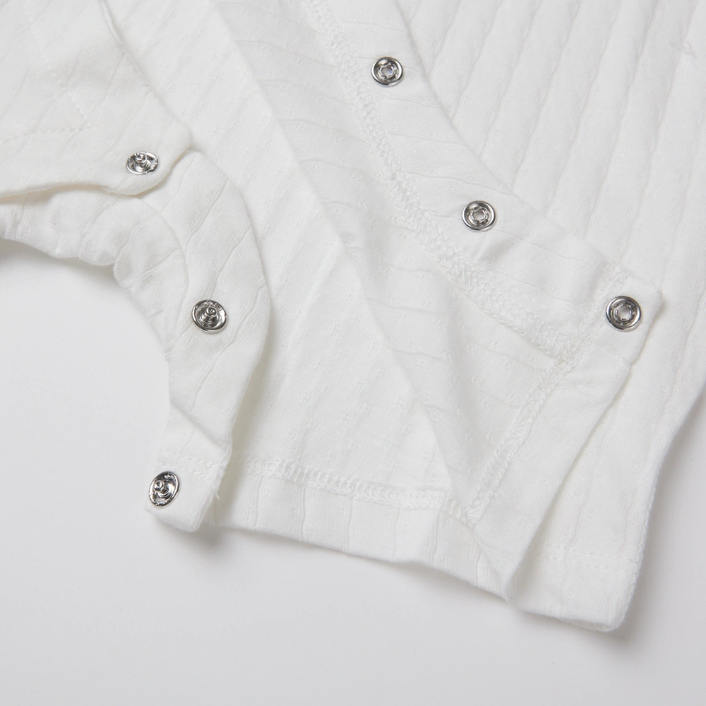 Close-up of nickel-free snaps on organic cotton onesie