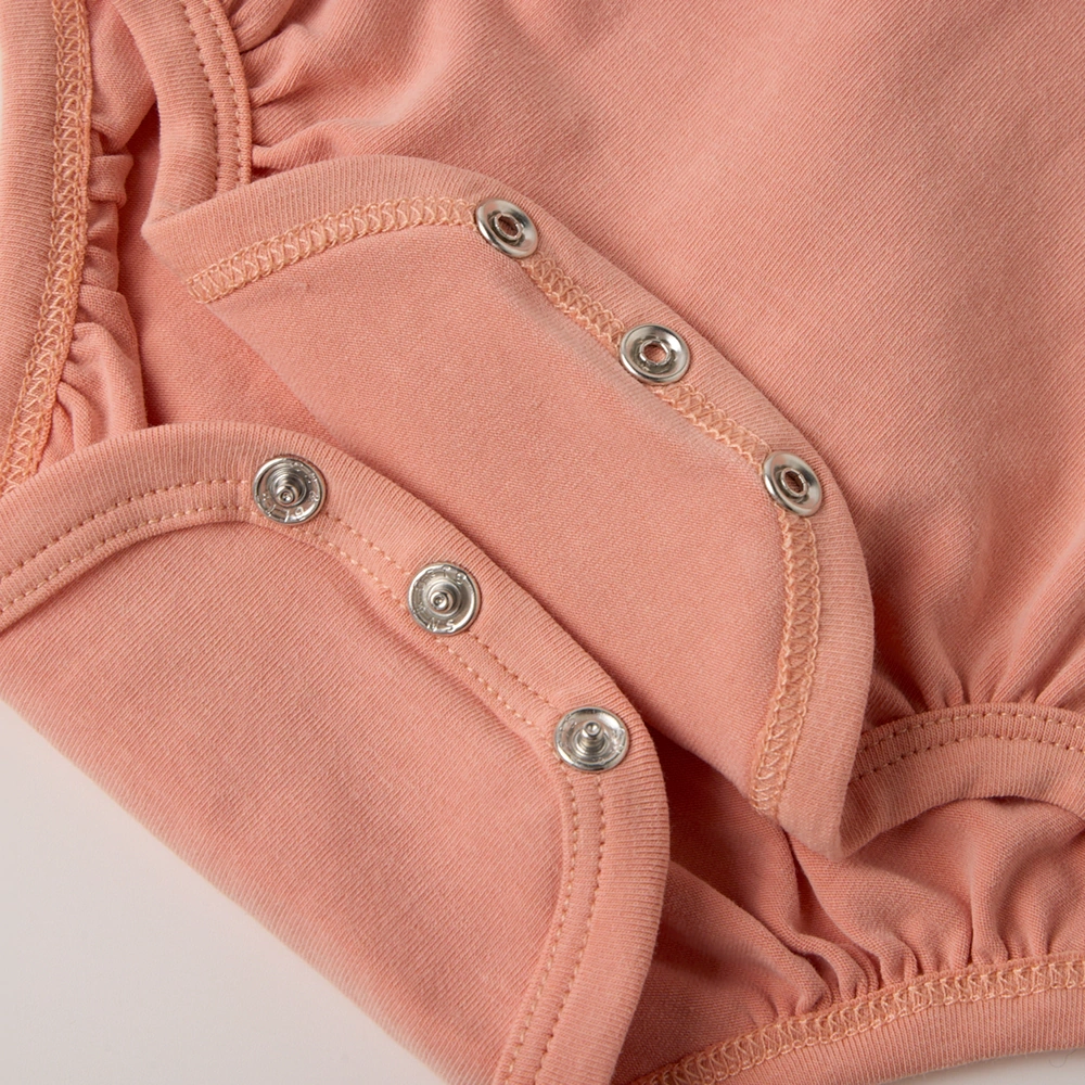 Organic pumpkin baby bodysuit and hat set made with plant-dyed GOTS organic cotton