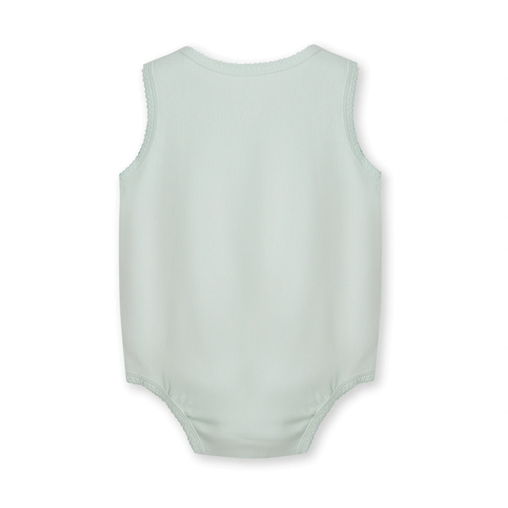 Baby girl wearing plant-dyed organic-cotton sleeveless bodysuit with snap crotch and soft bindings
