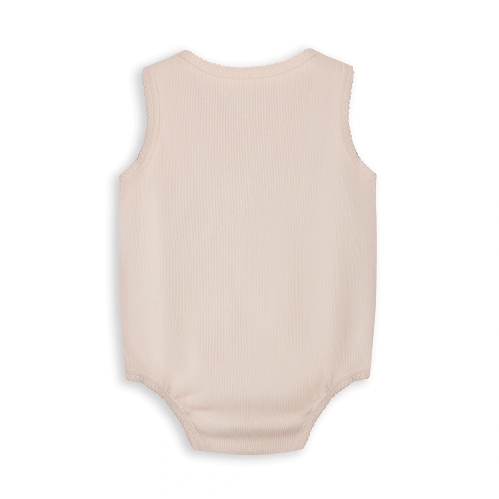 Baby girl wearing plant-dyed organic-cotton sleeveless bodysuit with snap crotch and soft bindings