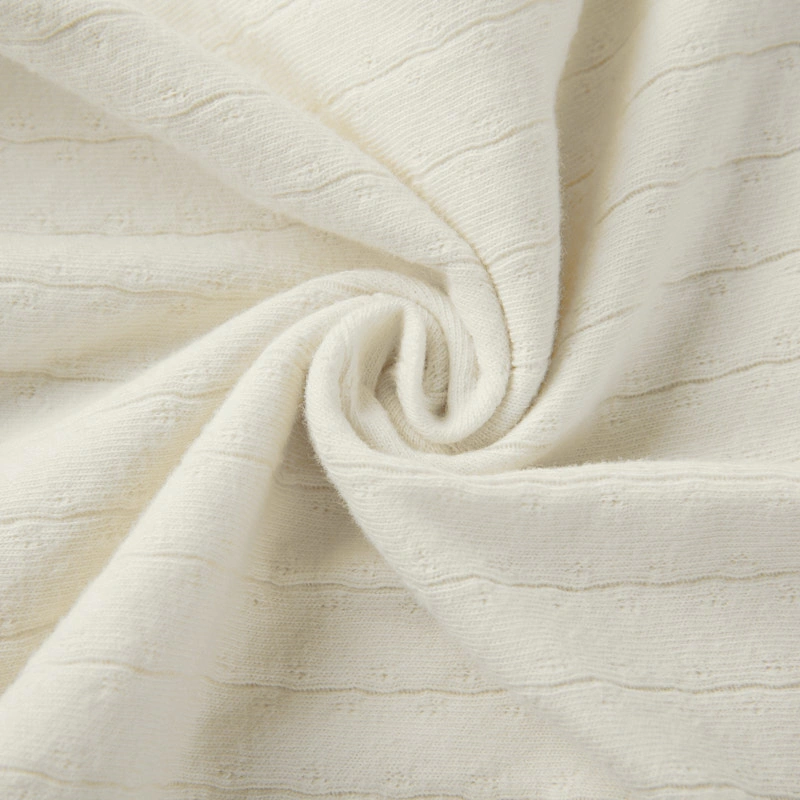 Baby wearing organic cotton plant-dyed unisex romper

