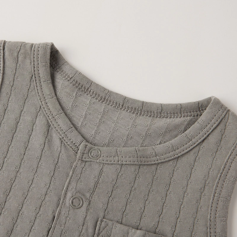 Close-up of airy pointelle knit on organic cotton baby romper