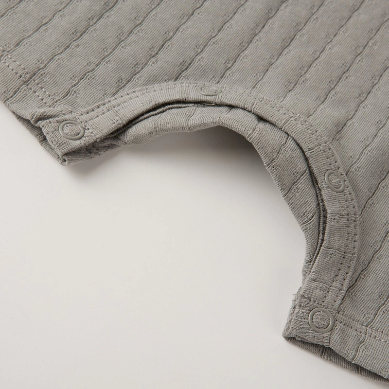 Baby wearing organic cotton plant-dyed unisex romper

