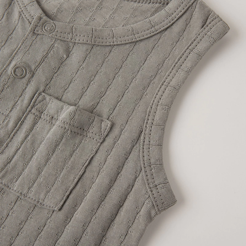 Front pocket detail on unisex baby pointelle romper
