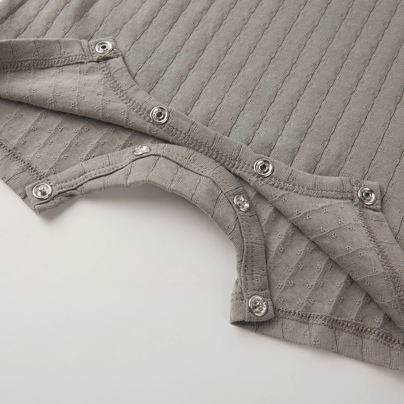 Nickel-free gusset snaps on plant-dyed organic cotton romper