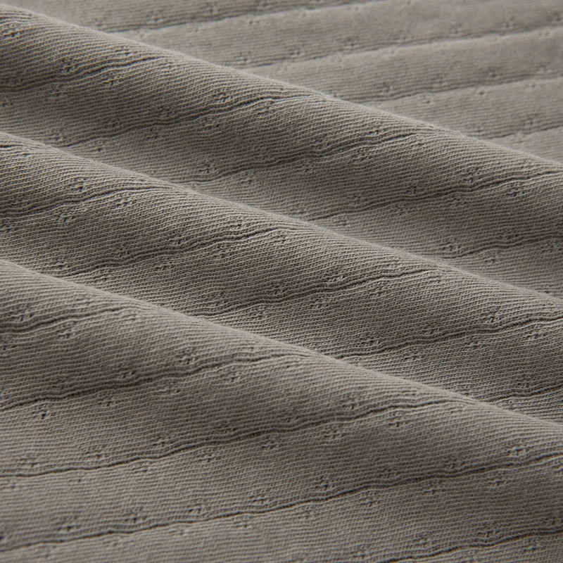 Baby wearing organic cotton plant-dyed unisex romper

