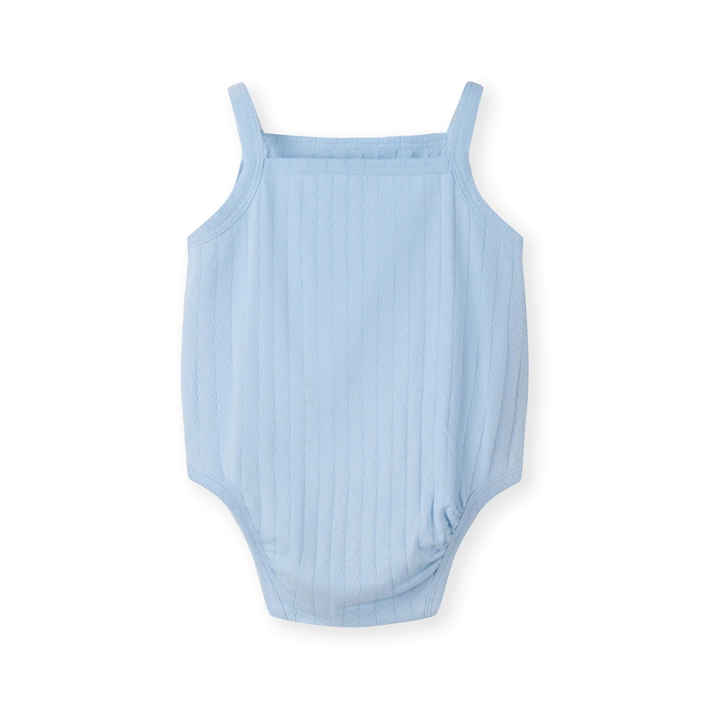 Baby girl wearing Senseng organic cotton pointelle strappy bodysuit, plant-dyed, breathable and eco-friendly