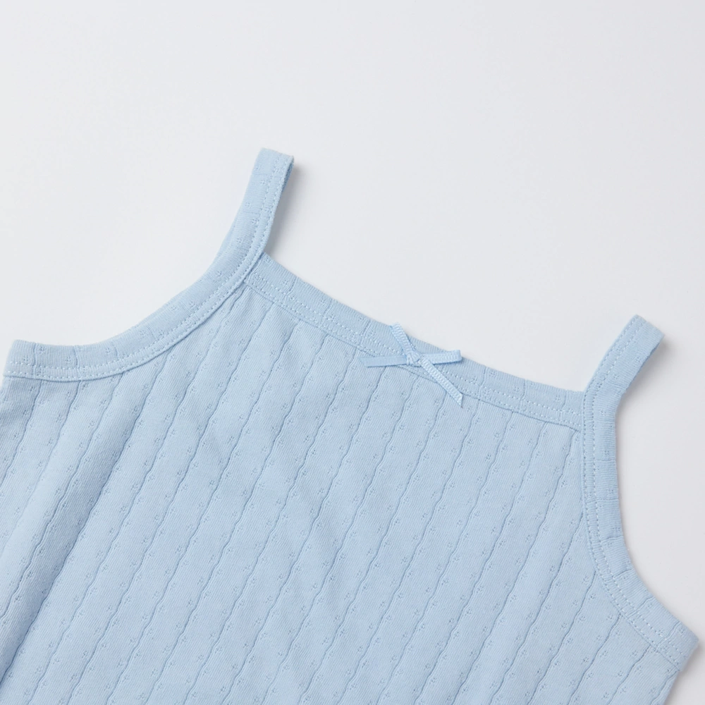 Baby girl wearing Senseng organic cotton pointelle strappy bodysuit, plant-dyed, breathable and eco-friendly