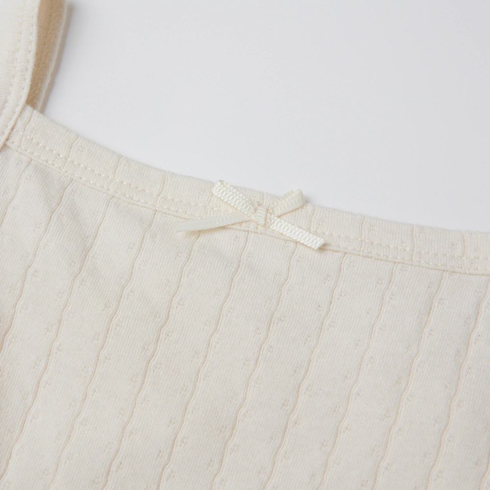 Baby girl wearing Senseng organic cotton pointelle strappy bodysuit, plant-dyed, breathable and eco-friendly