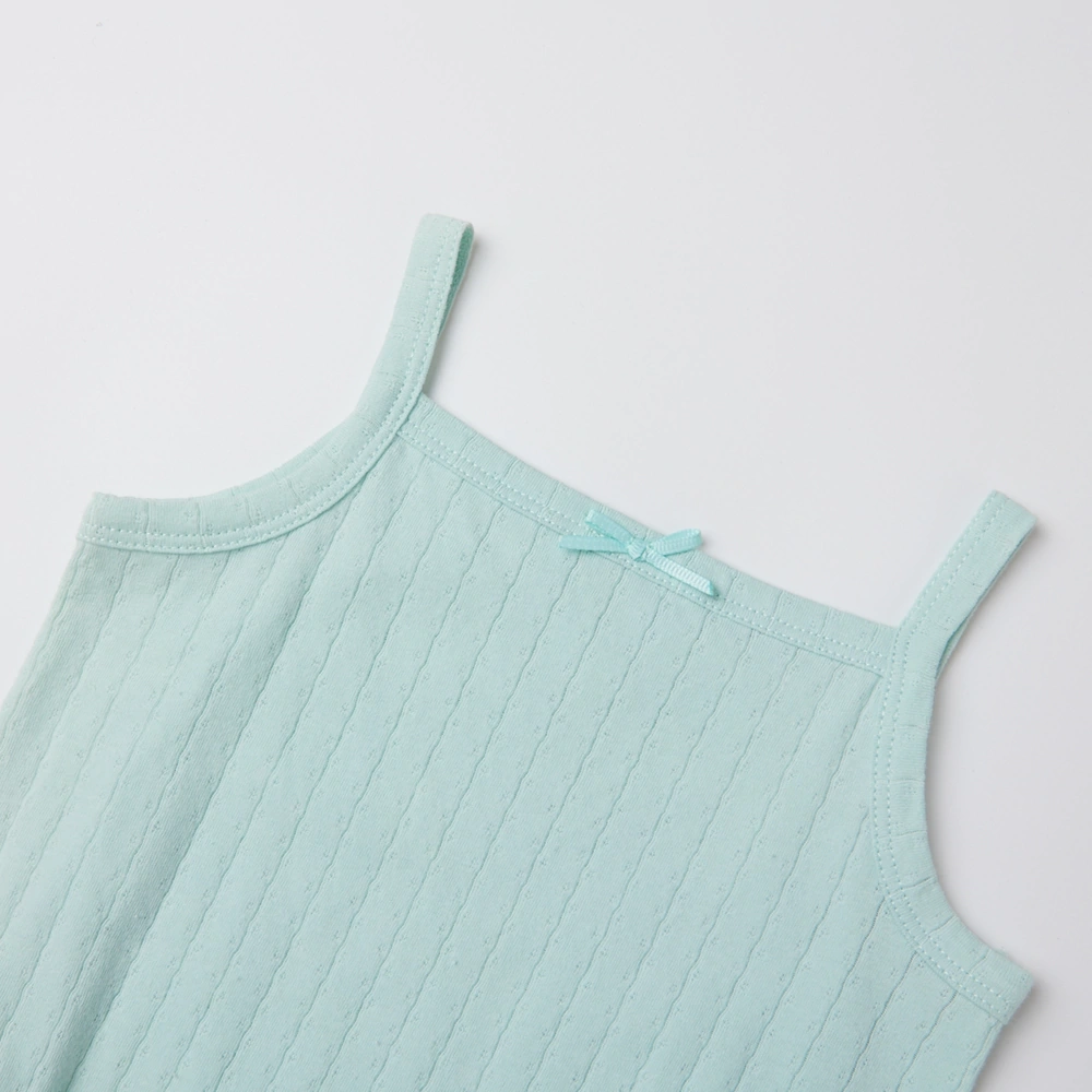 Baby girl wearing Senseng organic cotton pointelle strappy bodysuit, plant-dyed, breathable and eco-friendly