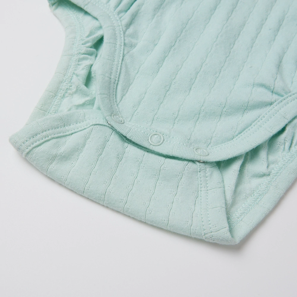 Baby girl wearing Senseng organic cotton pointelle strappy bodysuit, plant-dyed, breathable and eco-friendly