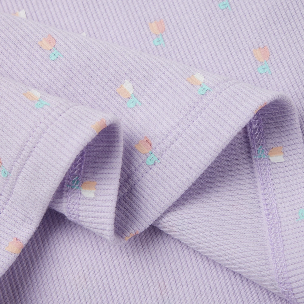 Baby girl long sleeve ribbed button-up top and pants set made from organic cotton with natural plant dyes