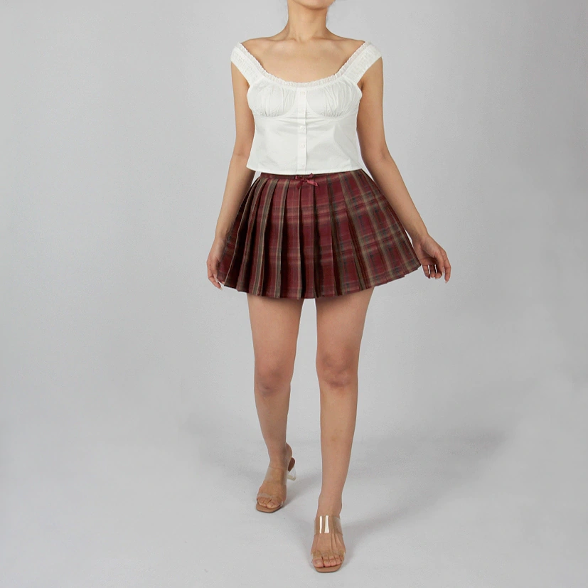 Casual outfit styling with black check pleated skirt