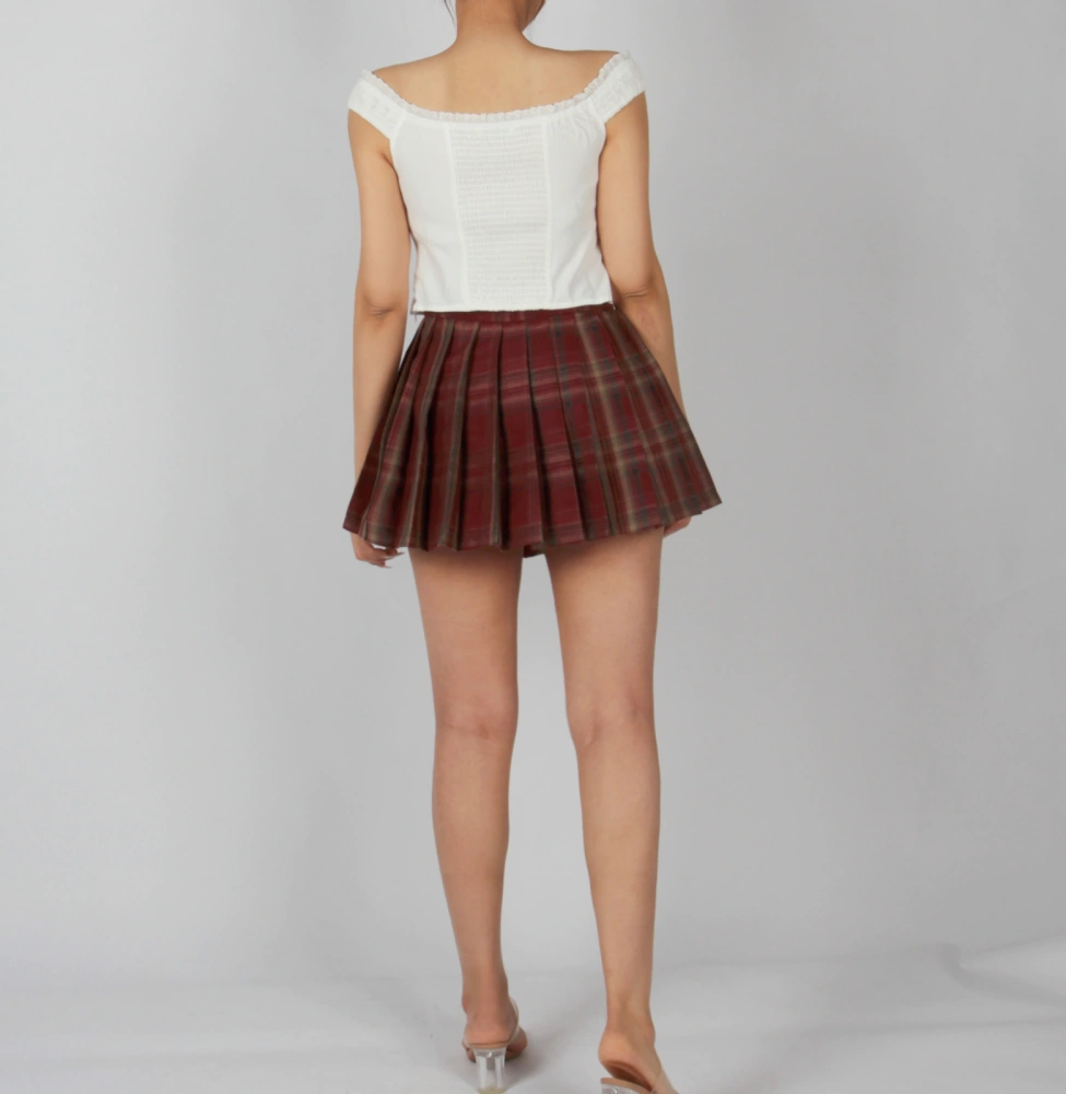 Casual outfit styling with black check pleated skirt