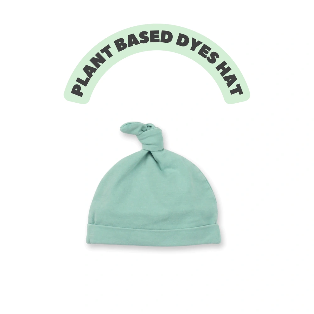 Organic-cotton baby boutique beanie in plant-dyed color with folded ear-cozy cuff 