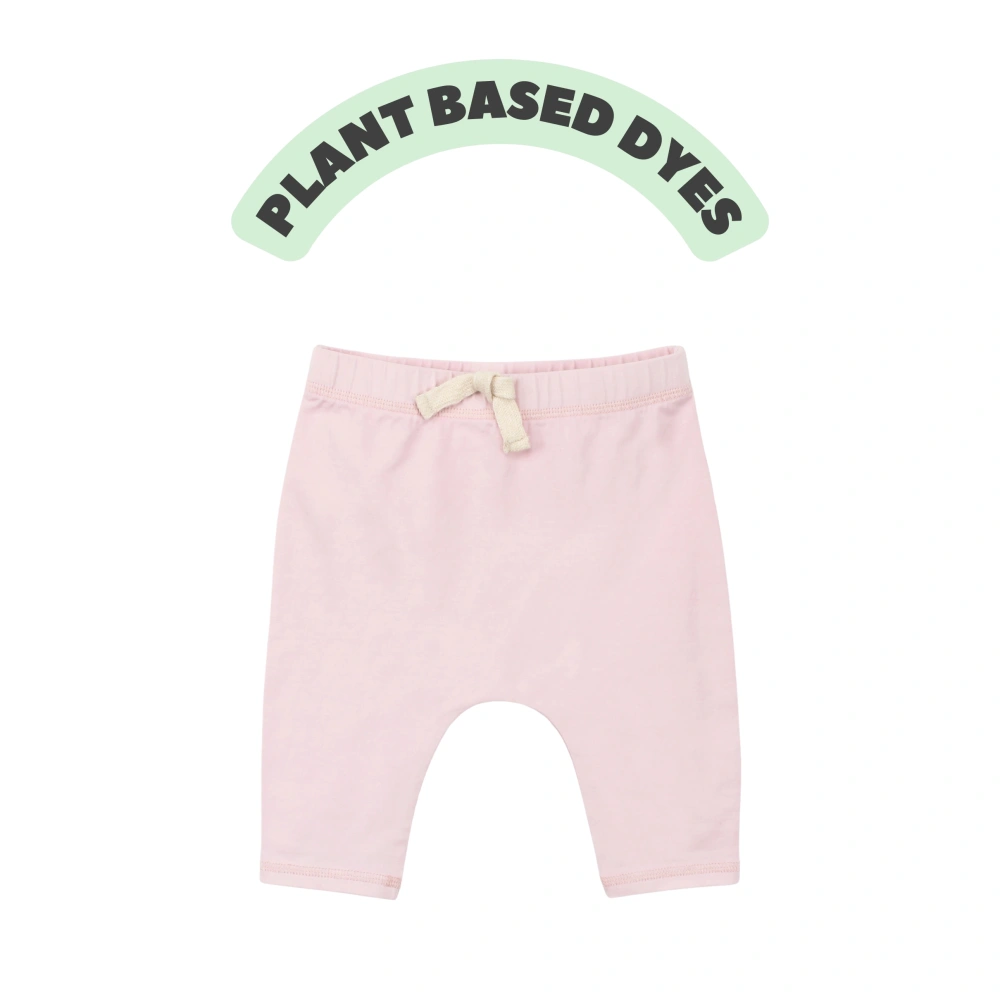 Senseng organic cotton baby jogger pants in plant-dyed salmon shade, eco-friendly toddler joggers (0–18M)