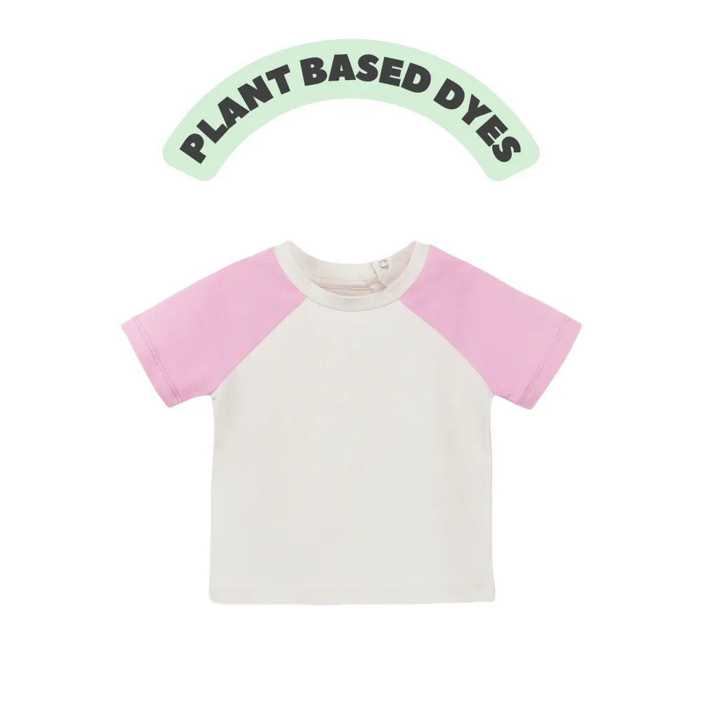 Organic plant-dyed Leo raglan short sleeve baby tee shown on a child