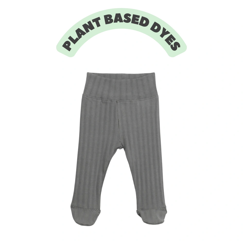 Baby wearing ribbed plant-dyed organic-cotton footed pants with soft elastic waist and covered toes
