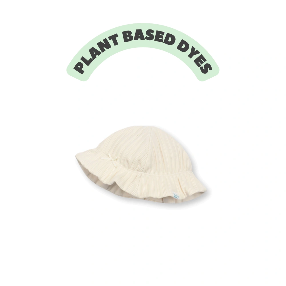 Plant-dyed organic-cotton ribbed bucket hat for babies with soft stretch lining and flexible brim. 