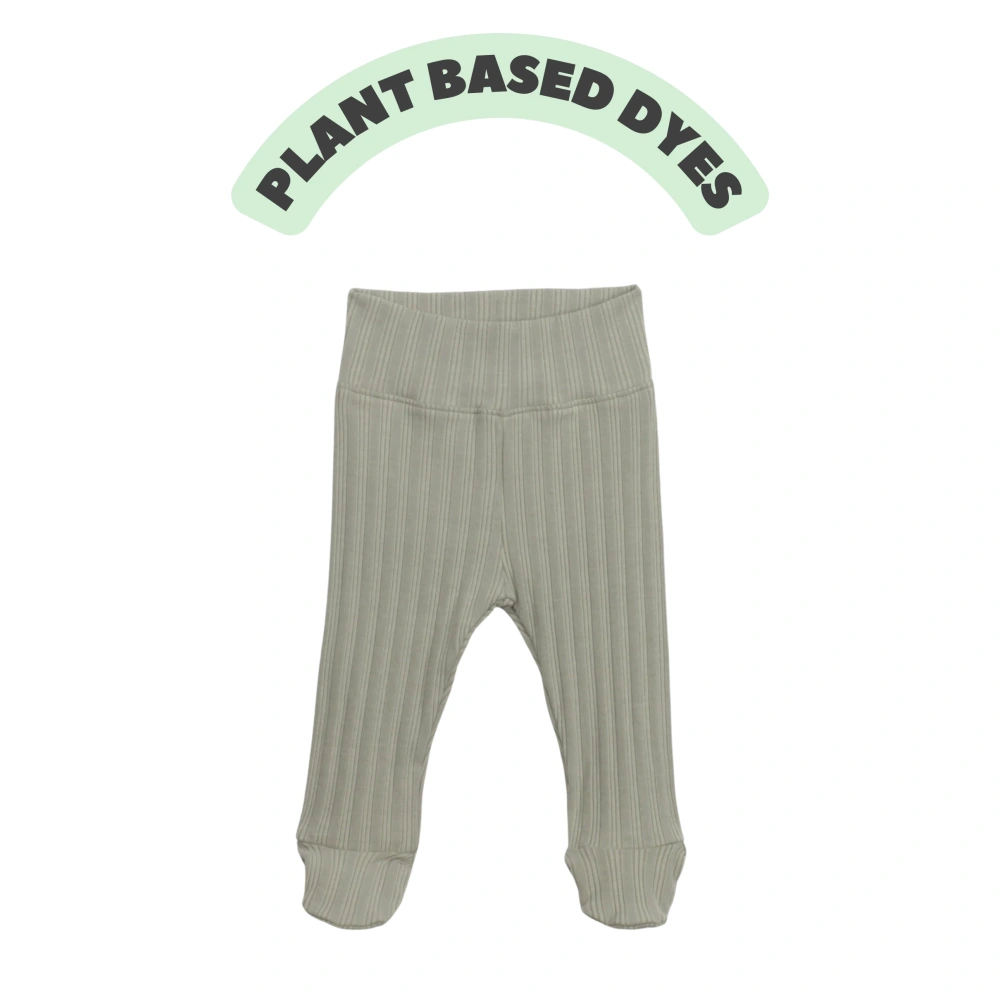 Baby wearing ribbed plant-dyed organic-cotton footed pants with soft elastic waist and covered toes