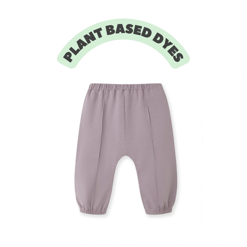 Baby wearing plant-dyed organic-cotton French terry jogger pants with tied waist (style k1230876)