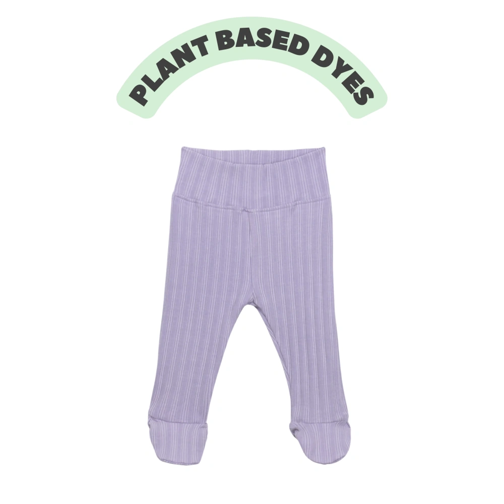 Baby wearing ribbed plant-dyed organic-cotton footed pants with soft elastic waist and covered toes