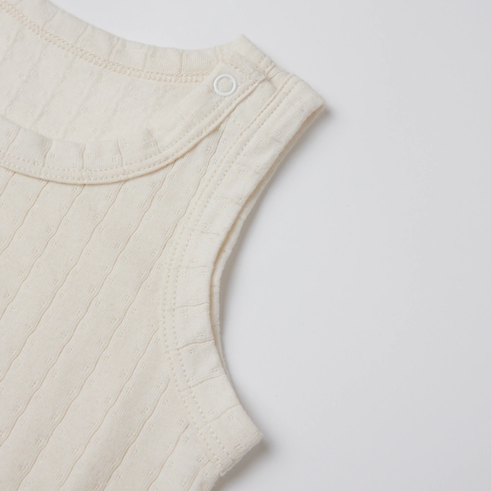 Pointelle sleeveless organic cotton baby bodysuit with plant-based dyes, eco-friendly design for infants 0-18 months