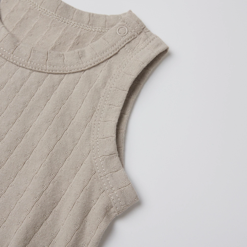 Pointelle sleeveless organic cotton baby bodysuit with plant-based dyes, eco-friendly design for infants 0-18 months