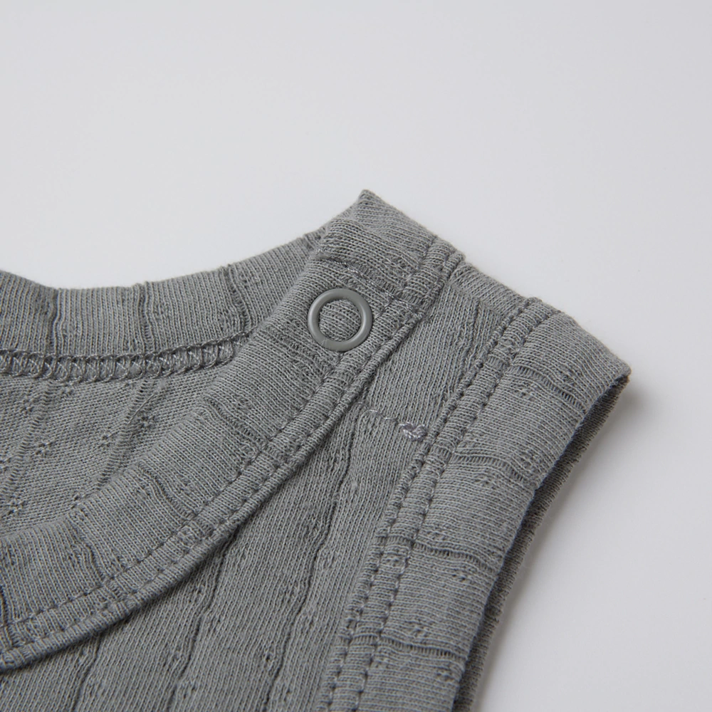 Pointelle sleeveless organic cotton baby bodysuit with plant-based dyes, eco-friendly design for infants 0-18 months